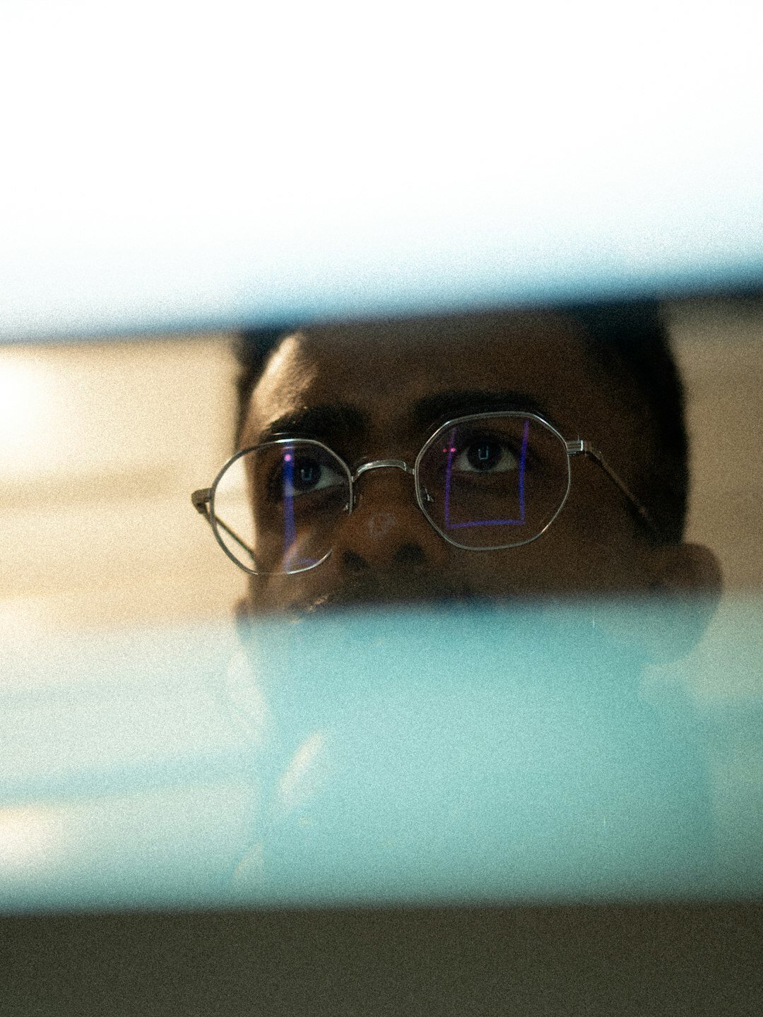 Studio portrait of a Belgian man analyst with glasses